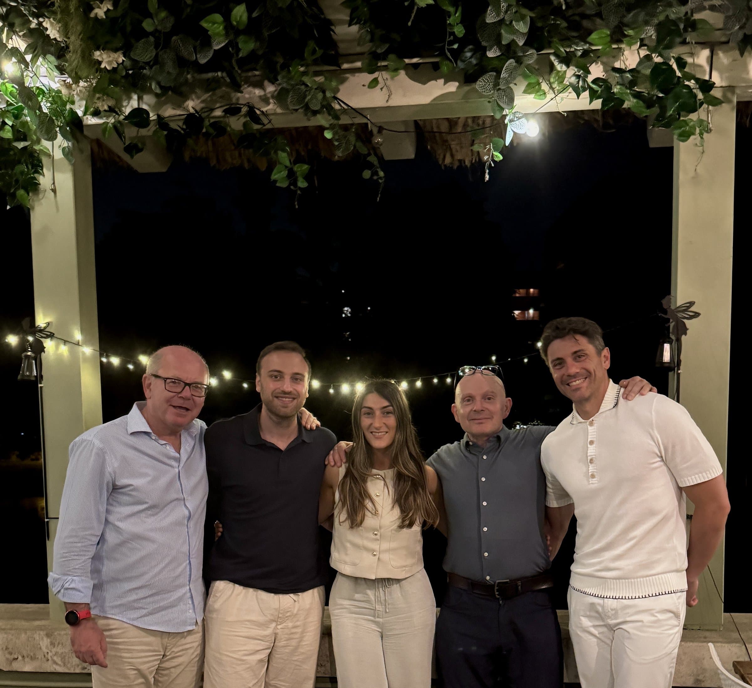 The team at an evening under the pergola